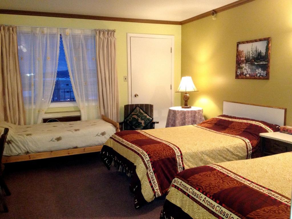 Hotel Motel Le Chateau Лак-Мегантик Номер фото